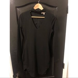 Black dress, open chest with neck covered